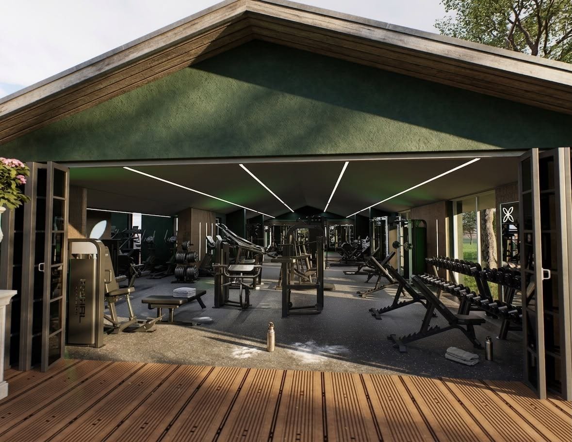 The gym wall fully opened onto the outdoor deck